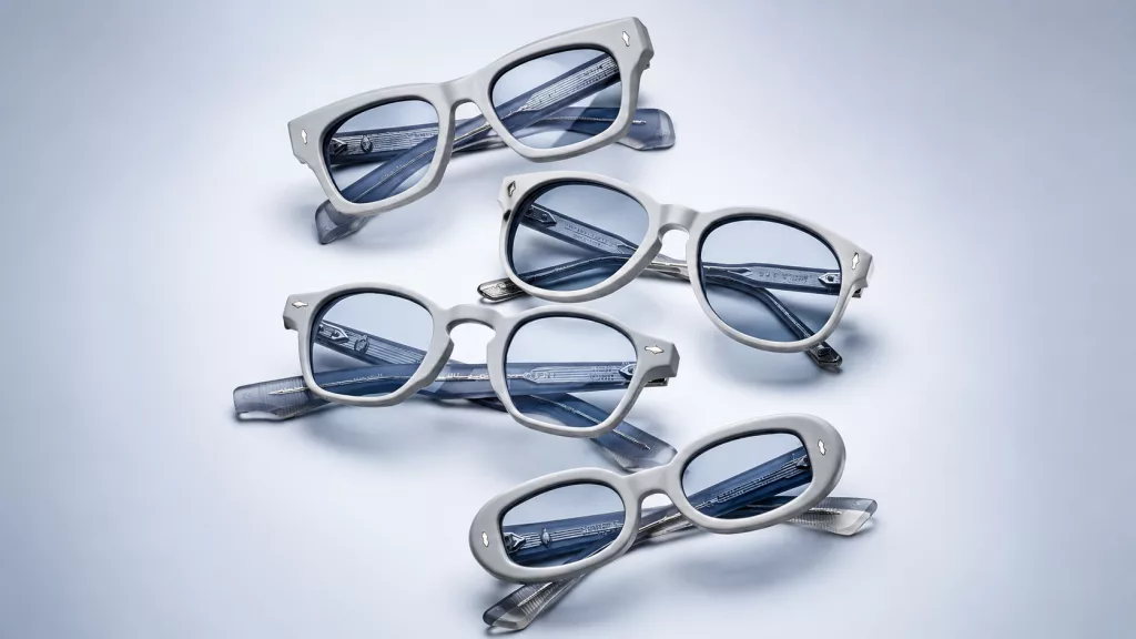 A pair of bold, sculpted Jacques Marie Mage sunglasses showing the intricate hand-polished acetate and gold hardware details