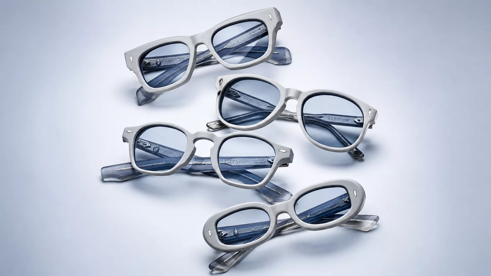 A pair of bold, sculpted Jacques Marie Mage sunglasses showing the intricate hand-polished acetate and gold hardware details